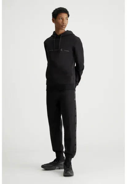 Pantaloni de trening cu croiala conica si benzi laterale cu logo - Negru