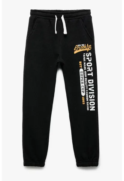 Pantaloni de trening cu imprimeu text - Alb fildes/Negru